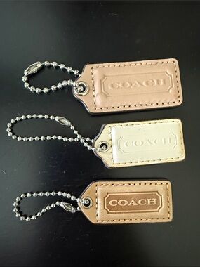 Coach Leather Tag Keychain Trio in Beige, Cream, Tan
